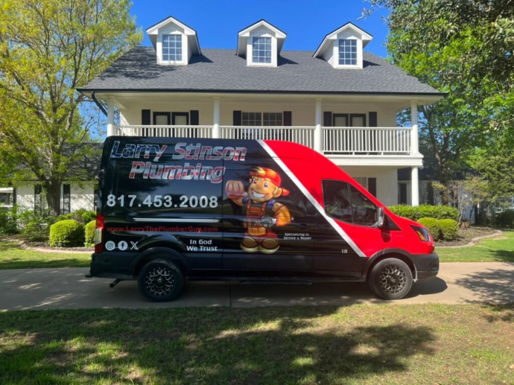 Plumbing service van parked by a house.