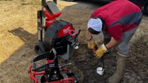 Worker using equipment for yard maintenance